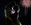 wedding couple looking at each other with fireworks in background