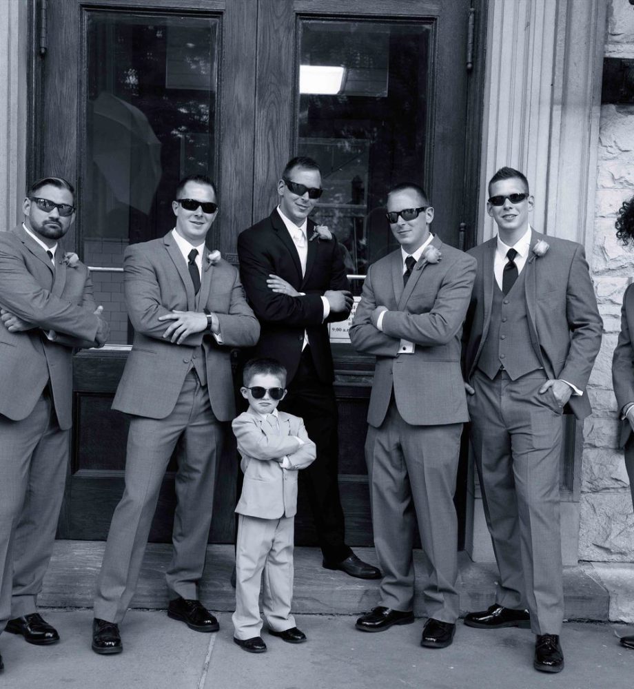 grooms men with sunglass looking at camera
